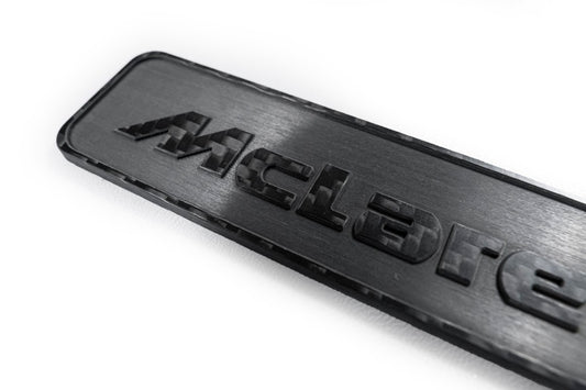 McLaren 570GT 2017 2018 2019 & 540C 570S 2016 2017 2018 2019 2020 & 600LT 2019 2020 & 620R 2021 & 675LT 650S 2015 2016 & 720S 2018 2019 2020 2021 2022 2023 & 750S 2024-ON & 765LT 2021 2022 & Artura 2023-ON & Elva 2021 & GT 2020 2021 2022 2023 & GTS 2025-ON & MP4-12C 2012 2013 2014 & P1 2013 2014 2015 & Senna 2019 2020 with Aftermarket Parts - Emblem Badge Carbon Fiber