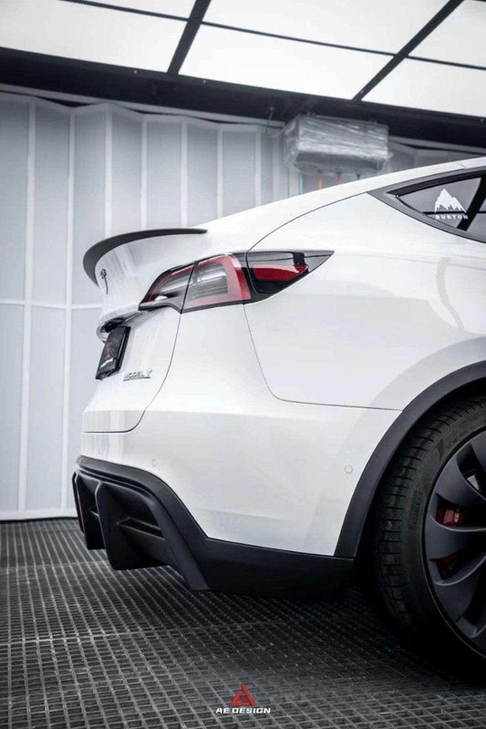 Tesla Model Y 2021 2022 2023 2024 with Aftermarket Parts - Plustic Style Rear Diffuser ABS from  ArmorExtend